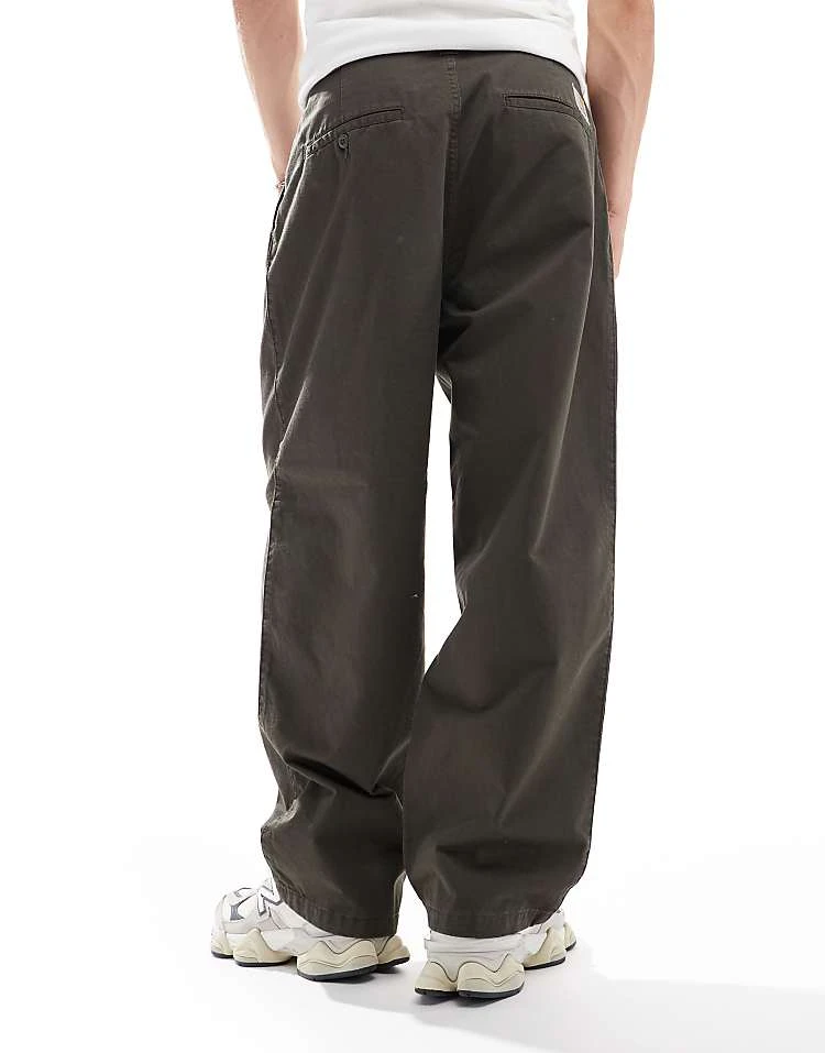 Carhartt WIP Merrick Tapered Fit Trousers In Green For Men 2 Carhartt WIP Merrick Tapered Fit Trousers In Green For Men - Image 2