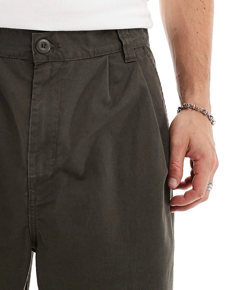 Carhartt WIP Merrick Tapered Fit Trousers In Green For Men 5 Carhartt WIP Merrick Tapered Fit Trousers In Green For Men - Image 5